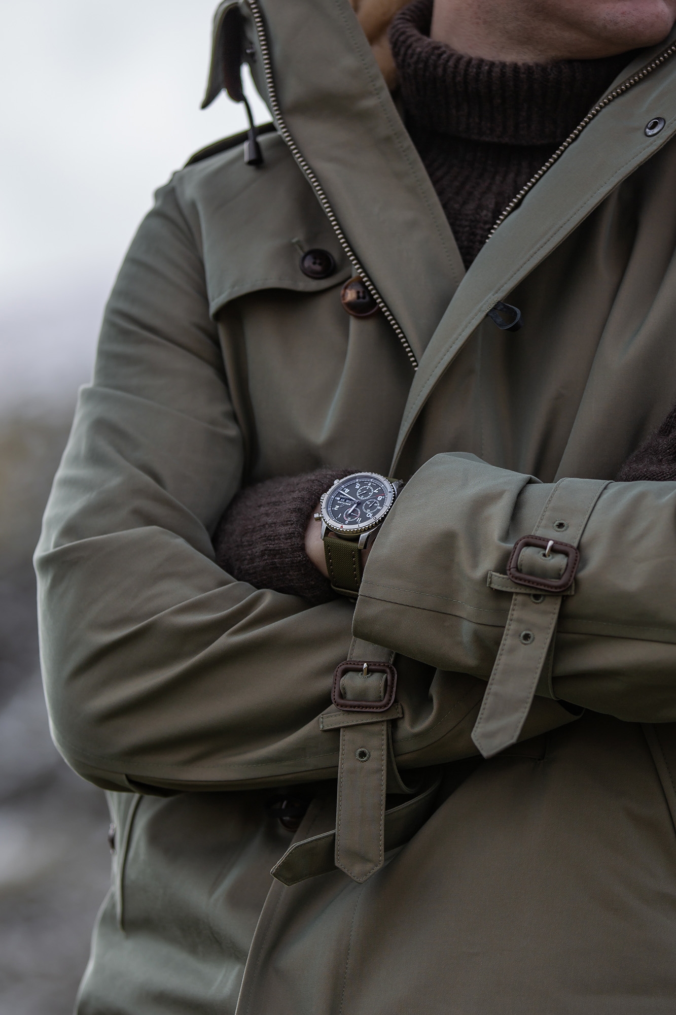 Man wearing Breitling watch outdoors