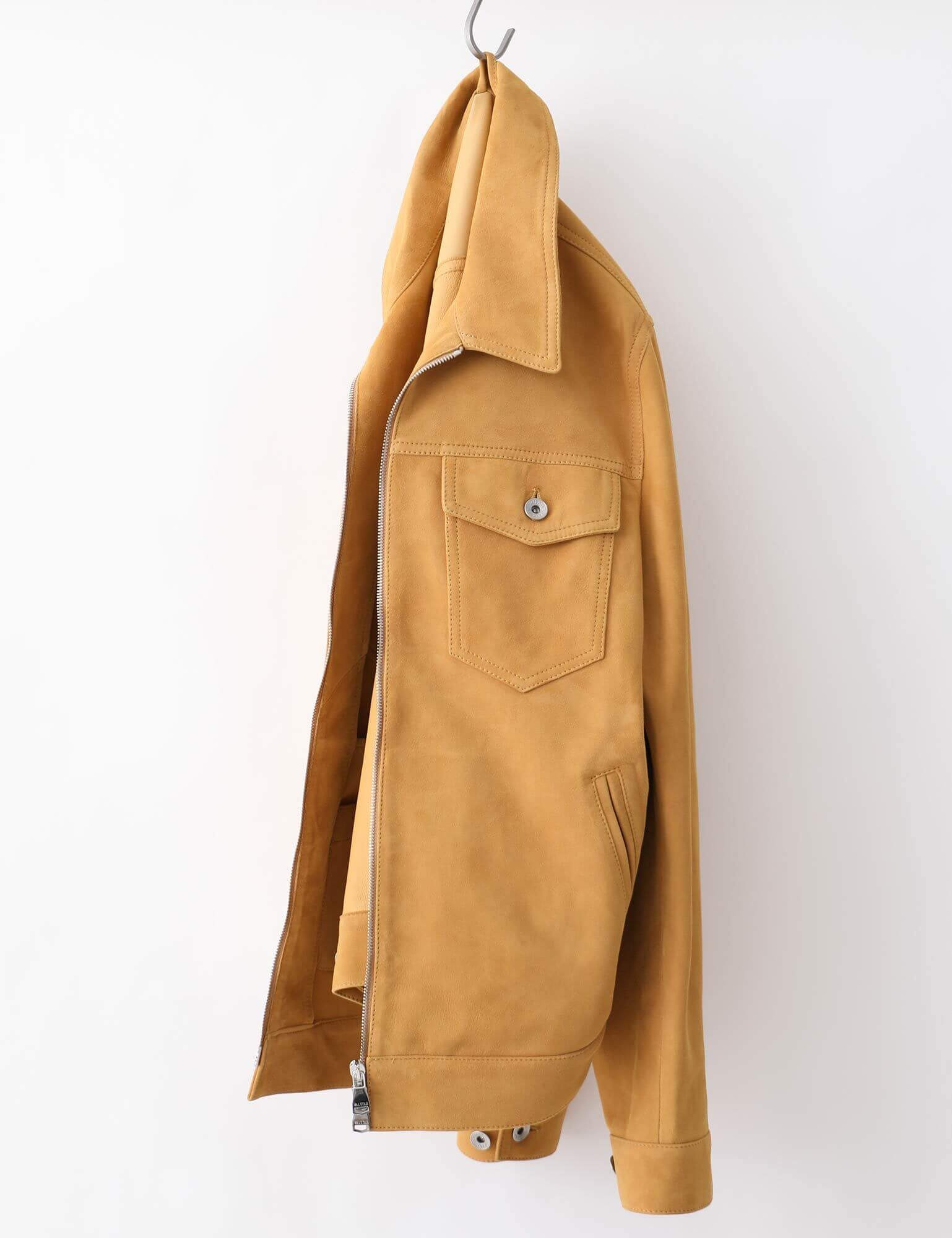 A suede Valstar Milano jacket hanging on a hook