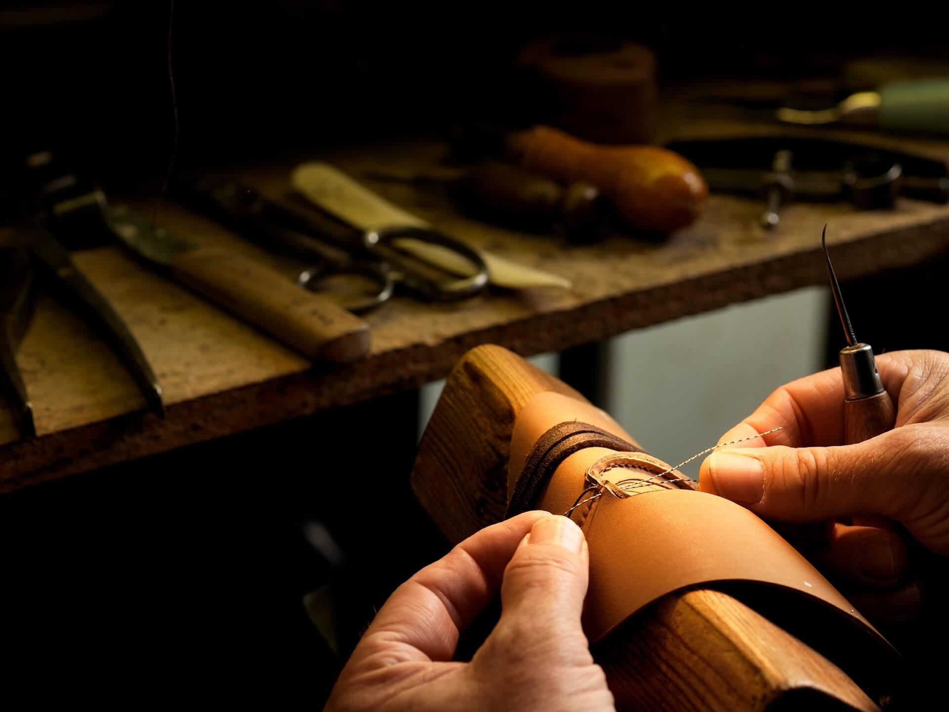 Shoe leather being stitched