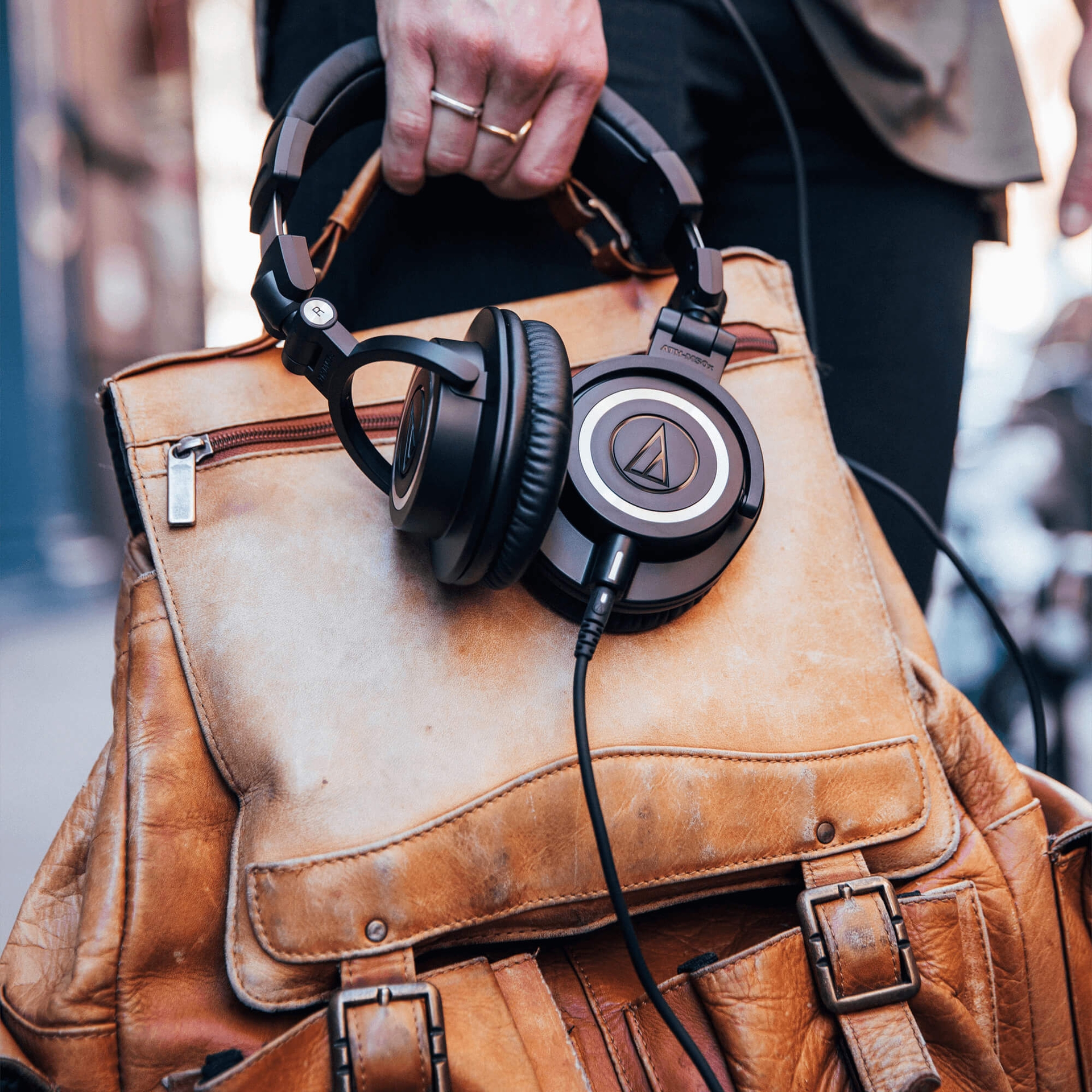 Audio-Technica ATH-M50x carried with a leather bag